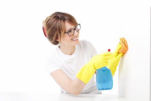 Technician handling cleaning products with care during carpet cleaning
