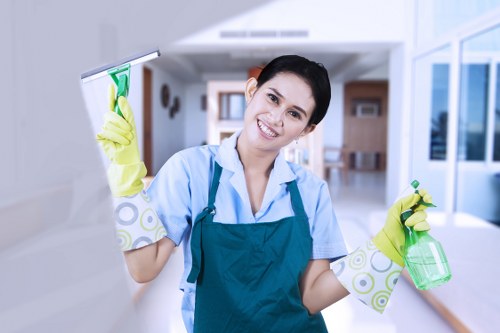 Staff member using proper lifting technique with carpet cleaning equipment