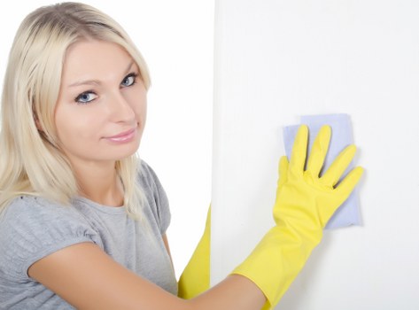 Specialist treating stains on a sofa during upholstery cleaning in Harrow